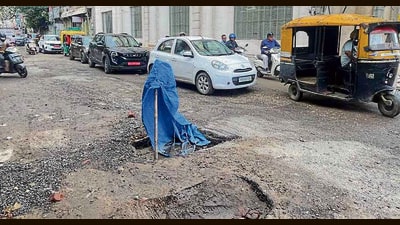 A potholed road near Pavillion mall in Ludhiana on Friday. (HT Photo) A potholed road near Pavillion mall in Ludhiana on Friday. (HT Photo)