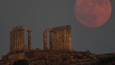 A Full Sturgeon Moon rises behind the ancient temple of Poseidon at Cape Sounion, about 70 kilometers (45 miles) south of Athens, Greece, Friday, Aug. 8, 2025. (AP Photo/Thanassis Stavrakis) (AP) A Full Sturgeon Moon rises behind the ancient temple of Poseidon at Cape Sounion, about 70 kilometers (45 miles) south of Athens, Greece, Friday, Aug. 8, 2025. (AP Photo/Thanassis Stavrakis) (AP)