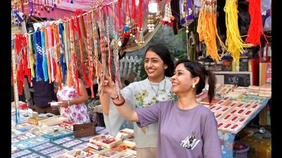 Girls buying rakhi at a shop in Jawahar Nagar Camp in Ludhiana on Friday. (HT Photo)