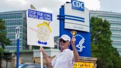 A man holds a sign as demonstrators gather outside of the U.S. Centers for Disease Control and Prevention (CDC) on June 25. (Representational) (REUTERS)