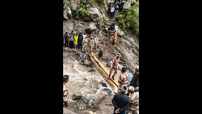 ITBP personnel rescue stranded Kailash Yatra pilgrims from cloudburst-hit Kinnaur, in Himachal Pradesh. (PTI) ITBP personnel rescue stranded Kailash Yatra pilgrims from cloudburst-hit Kinnaur, in Himachal Pradesh. (PTI)