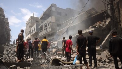 Palestinians check the devastation following an Israeli strike that hit Gaza City's southern al-Zeitoun neighbourhood on August 8, 2025. (AFP)