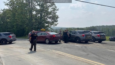 Police near the scene of shooting where two state troopers were injured, Thursday, August 7, 2025 near the village of Thompson in Susquehanna County, Pennsylvania. (WNEP via AP) Police near the scene of shooting where two state troopers were injured, Thursday, August 7, 2025 near the village of Thompson in Susquehanna County, Pennsylvania. (WNEP via AP)