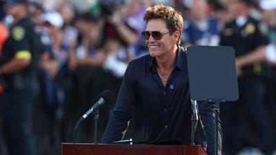 Tom Brady speaks during a statue unveiling before a game against the Washington Commanders at Gillette Stadium (IMAGN IMAGES via Reuters Connect)