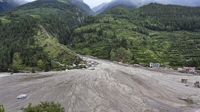 Dharali remains shrouded with mud and debris, carried downhill by the flash floods that hit the area on Tuesday. (PTI) Dharali remains shrouded with mud and debris, carried downhill by the flash floods that hit the area on Tuesday. (PTI)