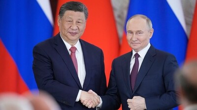 Russian President Vladimir Putin, right, and Chinese President Xi Jinping shake hands at the Kremlin in Moscow. (AP) Russian President Vladimir Putin, right, and Chinese President Xi Jinping shake hands at the Kremlin in Moscow. (AP)
