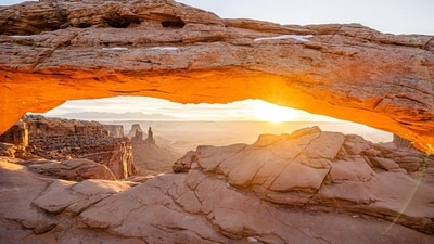 Sunrise at Mesa Arch in Canyonlands National Park in Utah, which receives much thinner crowds in August. Sunrise at Mesa Arch in Canyonlands National Park in Utah, which receives much thinner crowds in August.