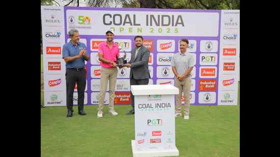 Angad Cheema (left) with Coal India Open 2025 winner’s trophy in Ahmedabad. (HT Photo)