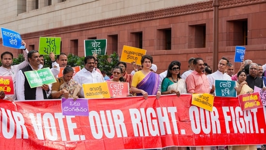 Opposition MPs protest against the Election Commission's Special Intensive Revision (SIR) of electoral rolls in Bihar, during the Monsoon session of Parliament on Friday. Opposition MPs protest against the Election Commission's Special Intensive Revision (SIR) of electoral rolls in Bihar, during the Monsoon session of Parliament on Friday.