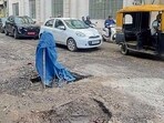 A potholed road near Pavillion mall in Ludhiana on Friday. (HT Photo)