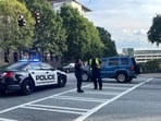 A Fulton County police officer talks to an Emory University student near the Center for Disease Control (CDC) in Atlanta after a shooting incident. A Fulton County police officer talks to an Emory University student near the Center for Disease Control (CDC) in Atlanta after a shooting incident.