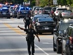 Police officers block Clifton Road near Emory Hospital as they respond to a shooting near the campuses of the U.S. Centers for Disease Control and Prevention and Emory University, Friday, Aug. 8, 2025, in (Hyosub Shin/Atlanta Journal-Constitution via AP) Police officers block Clifton Road near Emory Hospital as they respond to a shooting near the campuses of the U.S. Centers for Disease Control and Prevention and Emory University, Friday, Aug. 8, 2025, in (Hyosub Shin/Atlanta Journal-Constitution via AP)