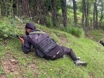 Security personnel during an ongoing encounter between security forces and terrorists in a forest area at Akhal, in Kulgam district, Jammu and Kashmir, 