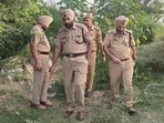 Police officials during investigation at the encounter spot. Police officials during investigation at the encounter spot.