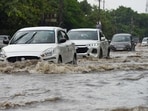 Vehicles wade through a waterlogged stretch in Sector 10, near Euro International School, in Gurugram on Saturday, following incessant rain. (Parveen Kumar/HT Photo) Vehicles wade through a waterlogged stretch in Sector 10, near Euro International School, in Gurugram on Saturday, following incessant rain. (Parveen Kumar/HT Photo)