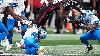 Detroit Lions safety Morice Norris was hit by Atlanta Falcons running back Nathan Carter during the second half of NFL preseason football game, (AP)