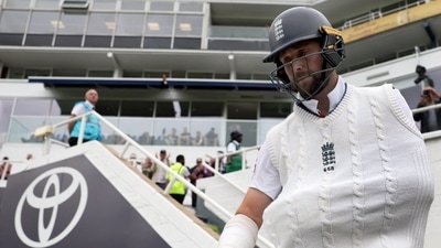 England's Chris Woakes walks out to bat (Action Images via Reuters)