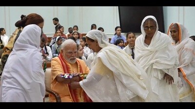Elderly widows from Vrindavan tying rakhi to PM Narendra Modi in Delhi on Saturday. (Video grab from PM X handle)
