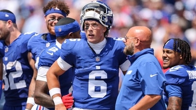 Jaxson Dart #6 of the New York Giants and head coach Brian Daboll speak during the second quarter of Bills vs Giants (Getty Images via AFP)