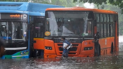 Water from the waterlogged roads entered the DTC buses in Delhi after heavy showers in the city. (PTI) Water from the waterlogged roads entered the DTC buses in Delhi after heavy showers in the city. (PTI)