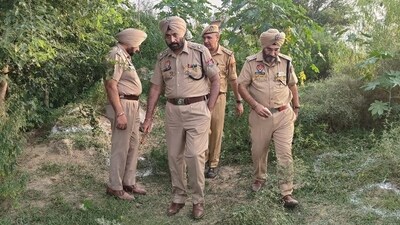 Police officials during investigation at the encounter spot. (HT photo)