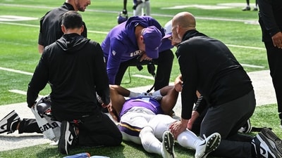 Minnesota Vikings wide receiver Rondale Moore (4) is attended to by head coach Kevin O'Connell (IMAGN IMAGES via Reuters Connect)