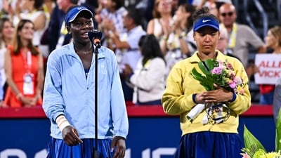 Victoria Mboko of Canada addresses the spectators following her victory against Naomi Osaka of Japan (Getty Images via AFP) Victoria Mboko of Canada addresses the spectators following her victory against Naomi Osaka of Japan (Getty Images via AFP)
