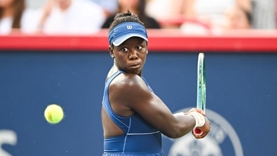 Victoria Mboko (CAN) returns the ball to Naomi Osaka (JPN) during singles final play at IGA Stadium (IMAGN IMAGES via Reuters Connect)