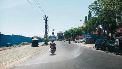 The presence of electric poles in the middle of a major road continues to create chaos and endanger lives, also highlighting the lack of coordination among civic departments. (HT PHOTO)