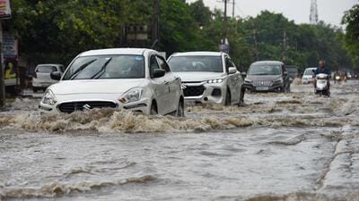 Vehicles wade through a waterlogged stretch in Sector 10, near Euro International School, in Gurugram on Saturday, following incessant rain. (Parveen Kumar/HT Photo) Vehicles wade through a waterlogged stretch in Sector 10, near Euro International School, in Gurugram on Saturday, following incessant rain. (Parveen Kumar/HT Photo)