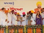 Cabinet minister Harbhajan Singh ETO (centre) with AAP leaders at the party’s event in Baba Bakala, Amritsar. (HT) Cabinet minister Harbhajan Singh ETO (centre) with AAP leaders at the party’s event in Baba Bakala, Amritsar. (HT)