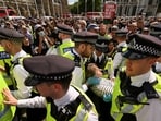 Police officers detain a protester during a rally organised by Defend Our Juries, challenging the British government's proscription of "Palestine Action" under anti-terrorism laws, in Parliament Square, in London. REUTERS/Jaimi Joy