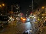 Lebanese soldiers look on as supporters of the Hezbollah militant group block the streets with burning tires while rallying in cars and motorbikes to protest the government's endorsement of a plan to disarm it, in Beirut's southern suburbs early on August 8, 2025. Lebanese soldiers look on as supporters of the Hezbollah militant group block the streets with burning tires while rallying in cars and motorbikes to protest the government's endorsement of a plan to disarm it, in Beirut's southern suburbs early on August 8, 2025.