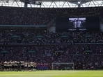 General view of players during a minutes silence in memory of Diogo Jota and Andre Silva before the match.