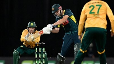 Cameron Green (C) hits a delivery as South African wicketkeeper Ryan Rickelton (L) looks on during the first T20 international cricket match between Australia and South Africa (AFP) Cameron Green (C) hits a delivery as South African wicketkeeper Ryan Rickelton (L) looks on during the first T20 international cricket match between Australia and South Africa (AFP)