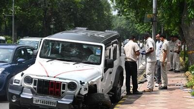 Forensic team and police examine the accident spot at Mother Teresa Crescent Road in Delhi on Sunday. (Vipin Kumar/HT) Forensic team and police examine the accident spot at Mother Teresa Crescent Road in Delhi on Sunday. (Vipin Kumar/HT)