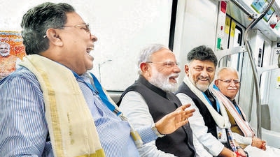 PM Narendra Modi with Karnataka CM Siddaramaiah, deputy CM DK Shivakumar, and Union minister Manohar Lal during a Metro ride in Bengaluru on Sunday. (ANI) PM Narendra Modi with Karnataka CM Siddaramaiah, deputy CM DK Shivakumar, and Union minister Manohar Lal during a Metro ride in Bengaluru on Sunday. (ANI)
