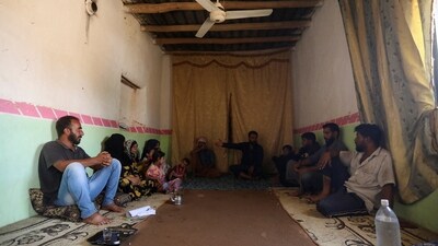 Villagers discuss air pollution in their village in Hasaka countryside, Syria, July 20, 2025. REUTERS/Orhan Qereman (REUTERS)