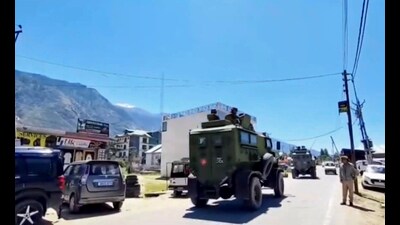 Security personnel patrol the area after an encounter broke out between terrorists and security forces in Kishtwar on Sunday. (PTI)