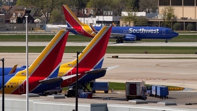 Southwest says it is taking care of travelers by booking hotel rooms, issuing refunds, and handing out travel vouchers to passengers. (REUTERS)