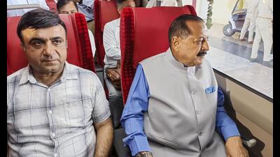 Union minister Jitendra Singh, right, in a Vande Bharat Express train, which was virtually inaugurated by Prime Minister Narendra Modi, at Katra Railway station, in Reasi district, Jammu and Kashmir on Sunday. (PTI)