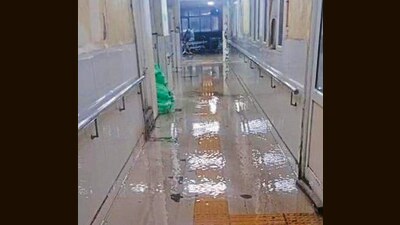 While patients and attendants waded through ankle-deep water, doctors and nurses found themselves assisting in draining out water instead of attending to patients. (HT)
