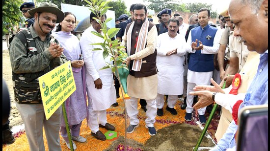 Haryana CM Nayab Singh Saini watering a sapling at the state-level Van Mahotsav event in Kurukshetra on Sunday. (Manoj Dhaka/HT)