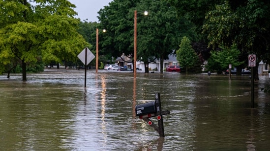 Flooding along the Menomonee River on August 10, 2025 in Wauwatosa, Wisconsin. Heavy downpours brought as much as 13 inches of rain to parts of southeast Wisconsin overnight, resulting in widespread flooding across the region.&nbsp;(Getty Images via AFP)