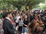 Activists protesting against the SC’s order outside the India Gate on Monday. (HT Photo)