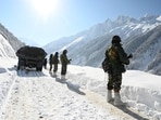 Indian army soldiers walk along a road near Zojila mountain pass that connects Srinagar to the union territory of Ladakh, bordering China. Indian army soldiers walk along a road near Zojila mountain pass that connects Srinagar to the union territory of Ladakh, bordering China.