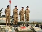 File photo: Chief of Army Staff of Pakistan Asim Munir holds a microphone during his visit at the Tilla Field Firing Ranges (TFFR)