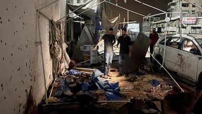 Palestinians inspect the site of an Israeli strike where Al Jazeera says its journalists Anas Al Sharif, Mohammed Qreiqeh and three photojournalists were killed, in Gaza City (REUTERS)