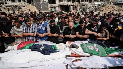 Palestinians pray over the bodies of journalists, including Al Jazeera correspondents Anas al-Sharif and Mohamed Qreiqeh, who were killed in an Israeli airstrike, during their funeral outside Gaza City's Shifa hospital complex, Monday, Aug. 11, 2025. (Jehad Alshrafi/AP) Palestinians pray over the bodies of journalists, including Al Jazeera correspondents Anas al-Sharif and Mohamed Qreiqeh, who were killed in an Israeli airstrike, during their funeral outside Gaza City's Shifa hospital complex, Monday, Aug. 11, 2025. (Jehad Alshrafi/AP)