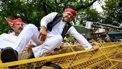 Samajwadi Party President Akhilesh Yadav was seen jumping a Delhi police barricade during a march led by India's opposition parties (AFP) Samajwadi Party President Akhilesh Yadav was seen jumping a Delhi police barricade during a march led by India's opposition parties (AFP)